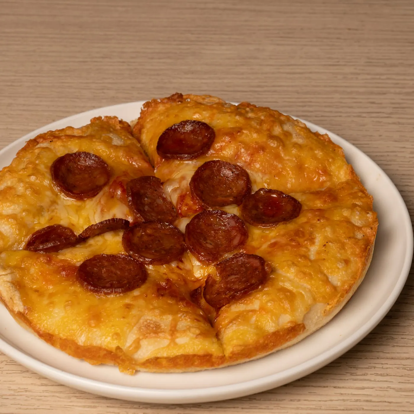 Kids pizza with pepperoni.